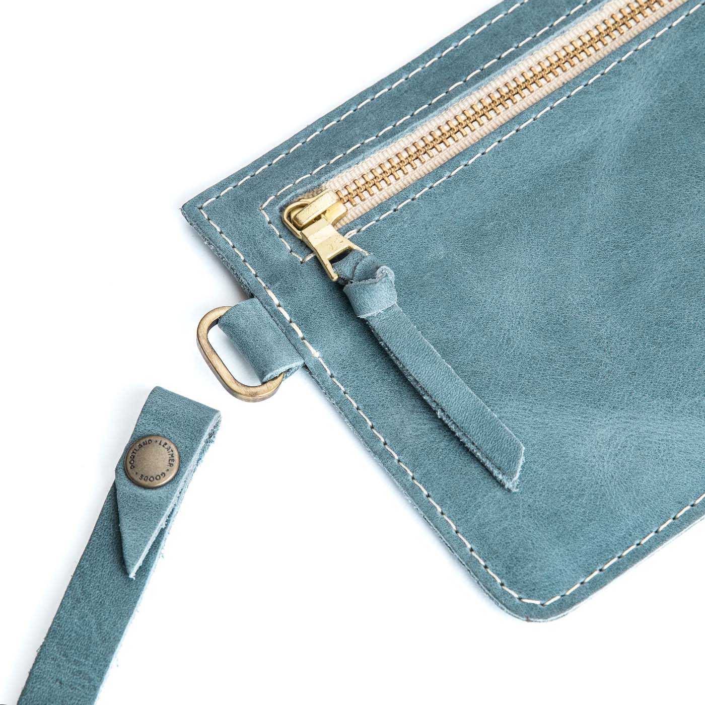 Aqua | Flat leather pouch with zipper and wristlet close up