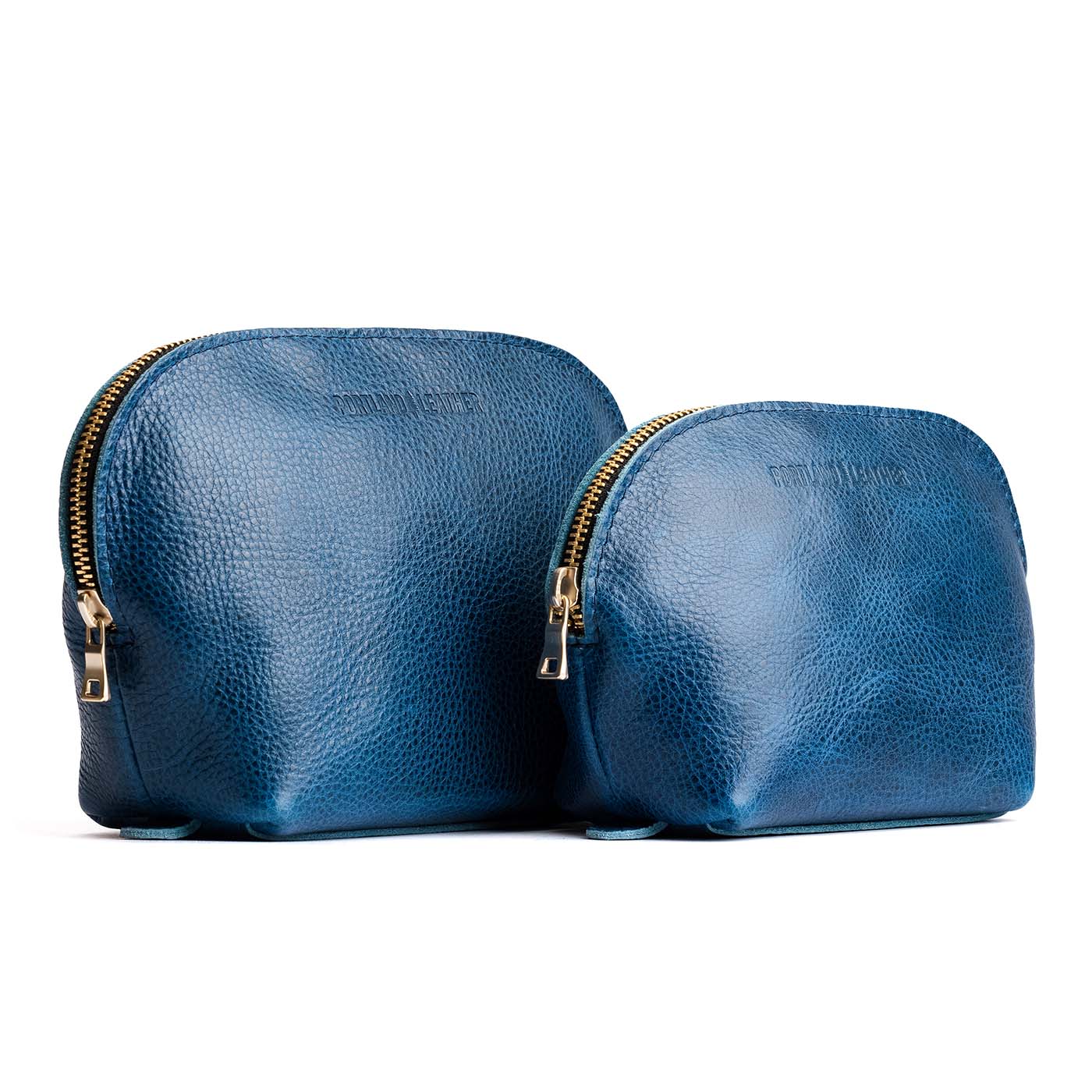 Caspian | Leather makeup bag with curved top zipper and flat bottom