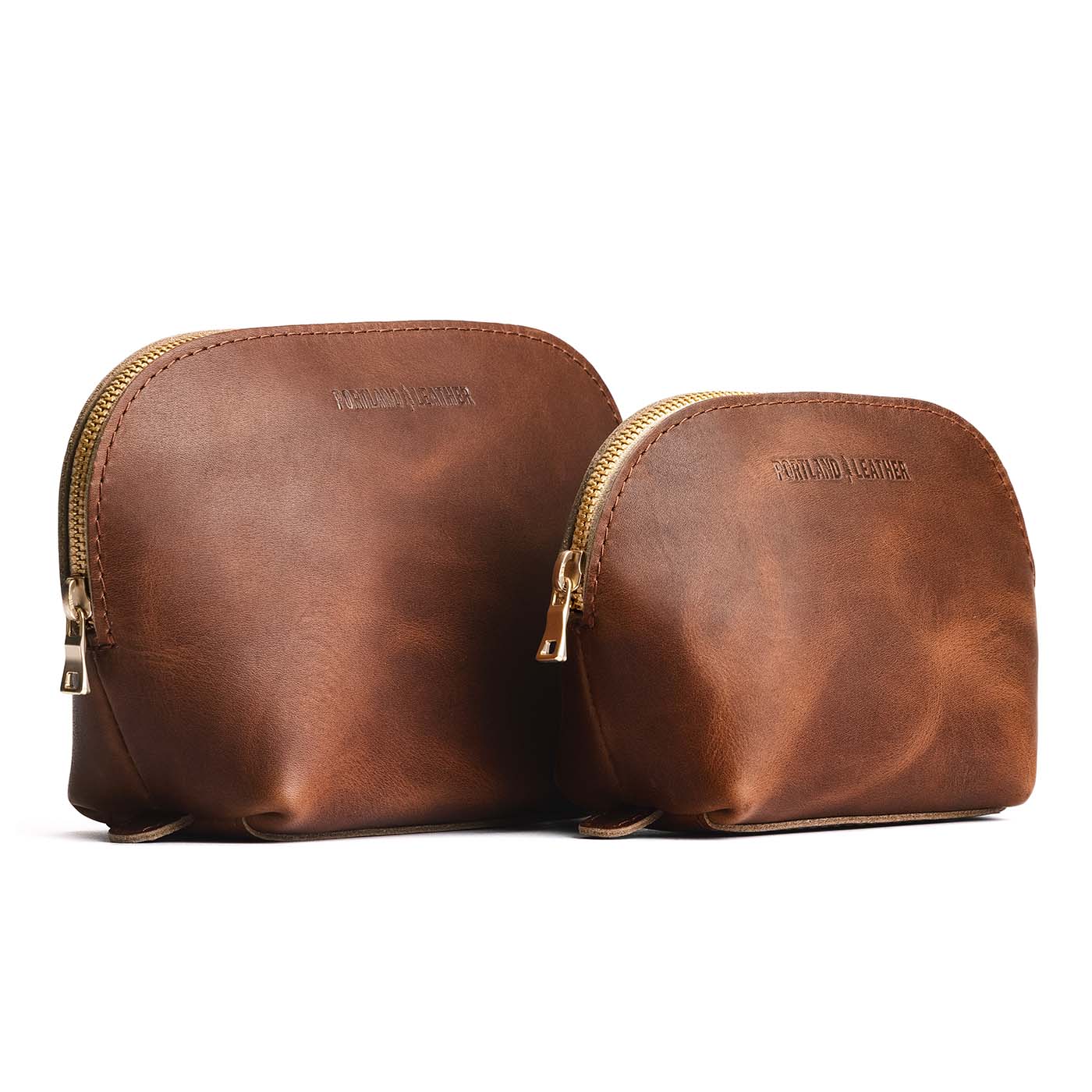 English Tan | Leather makeup bag with curved top zipper and flat bottom