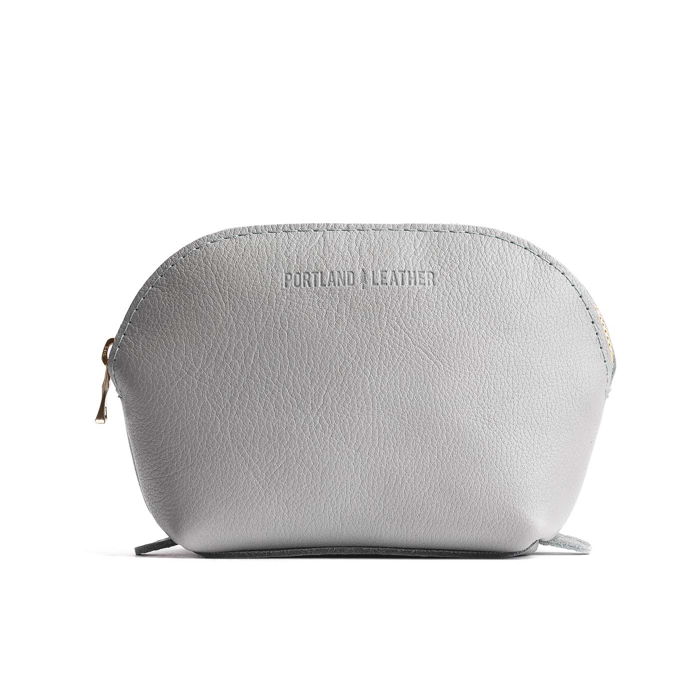 Nimbus*Bella | Leather makeup bag with curved top zipper and flat 