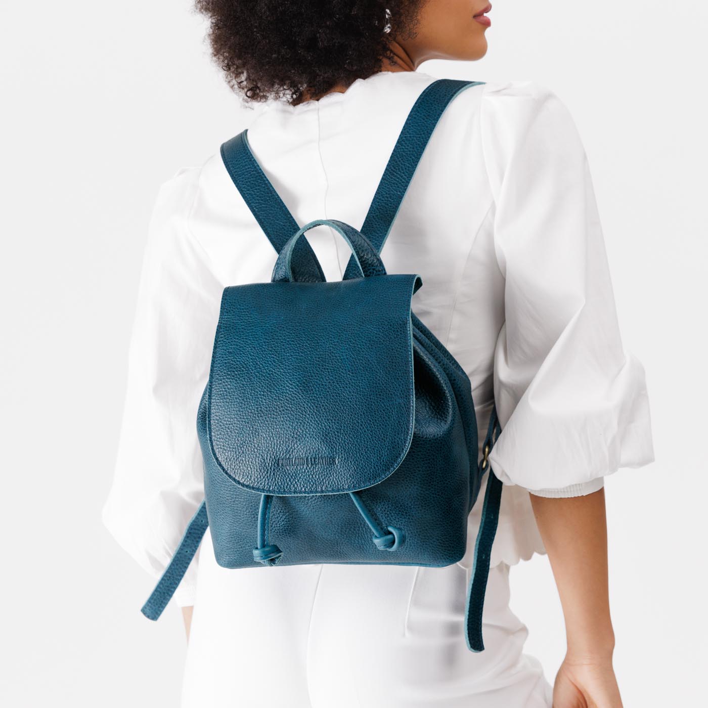 Caspian | Model wearing slouchy leather bucket backpack