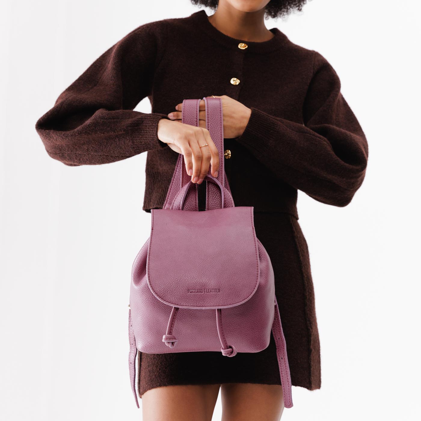 Kyoto | Model holding slouchy leather bucket backpack