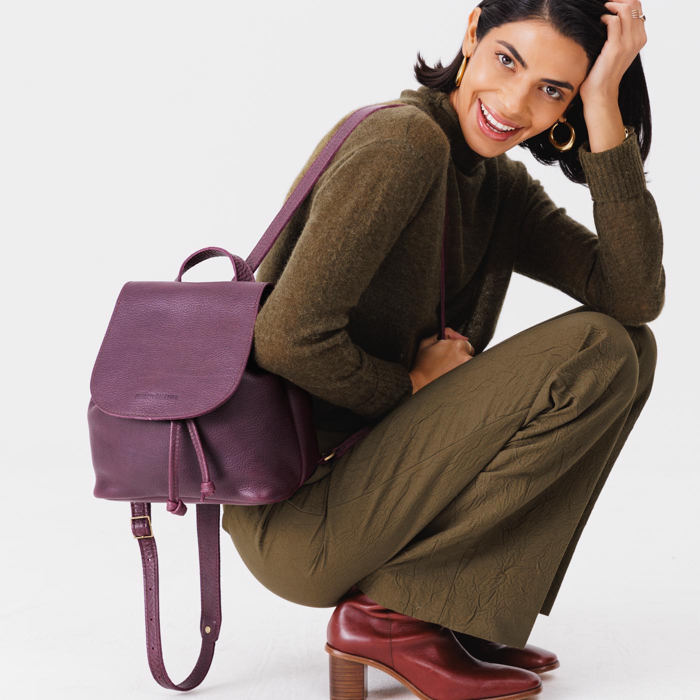 All Color: Plum | Model wearing slouchy leather bucket backpack