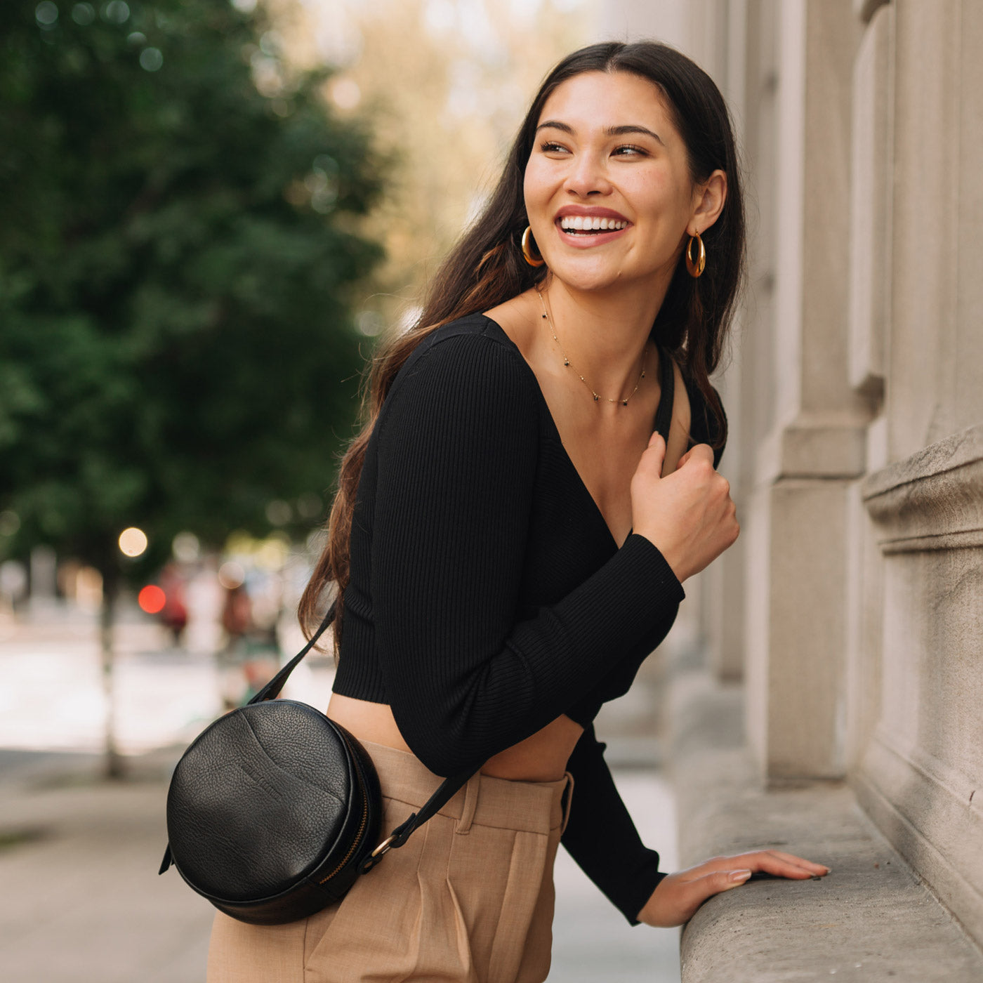 Pebbled--black Small | Circle shaped crossbody bag with top zipper