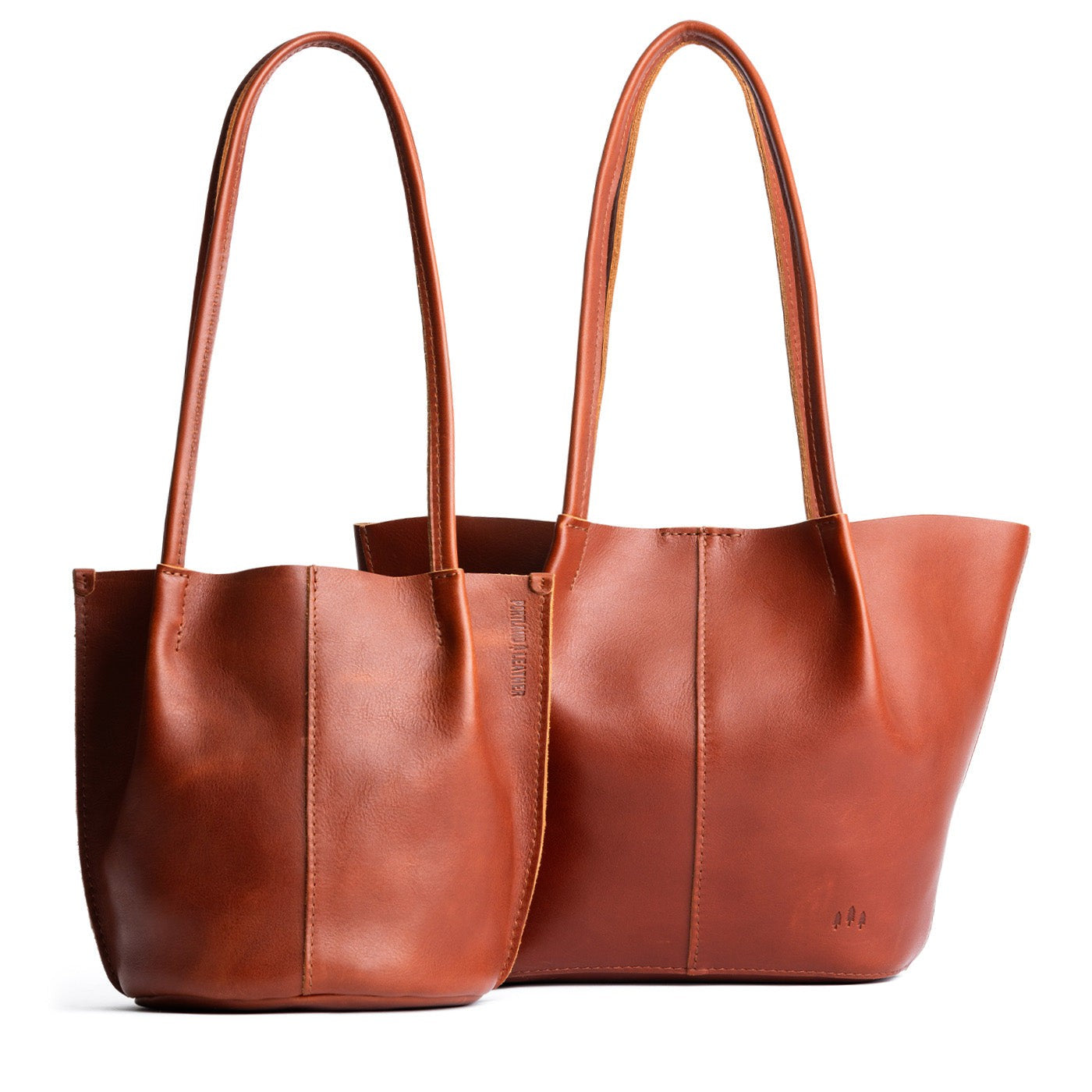 Chestnut | Size comparison of classic and large bucket shaped tote bags with matching leather handles