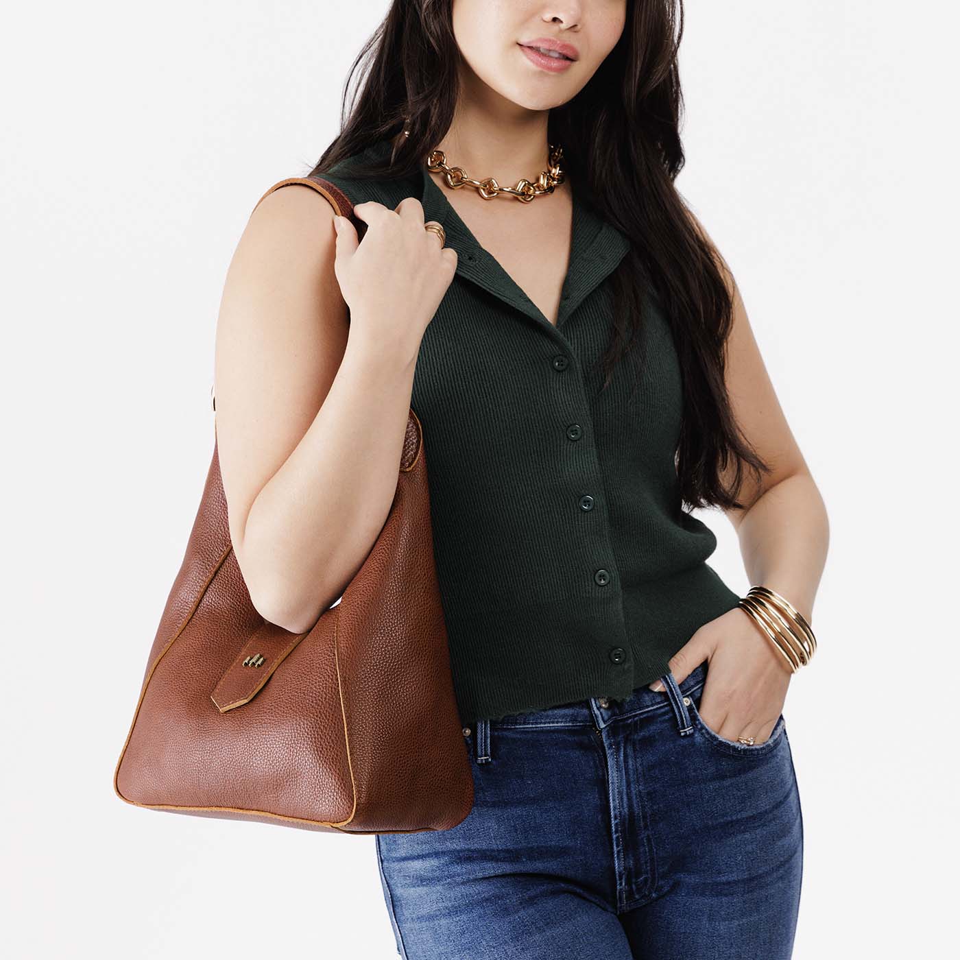 Nutmeg | Model wearing structured hobo shoulder bag with adjustable strap and magnetic closure