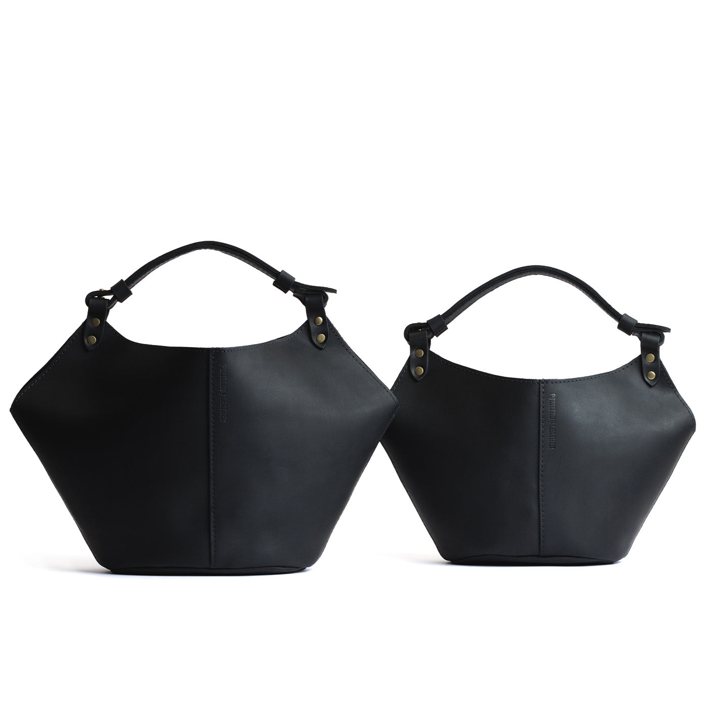 Black | Structured bucket shaped handbag with an adjustable shoulder strap