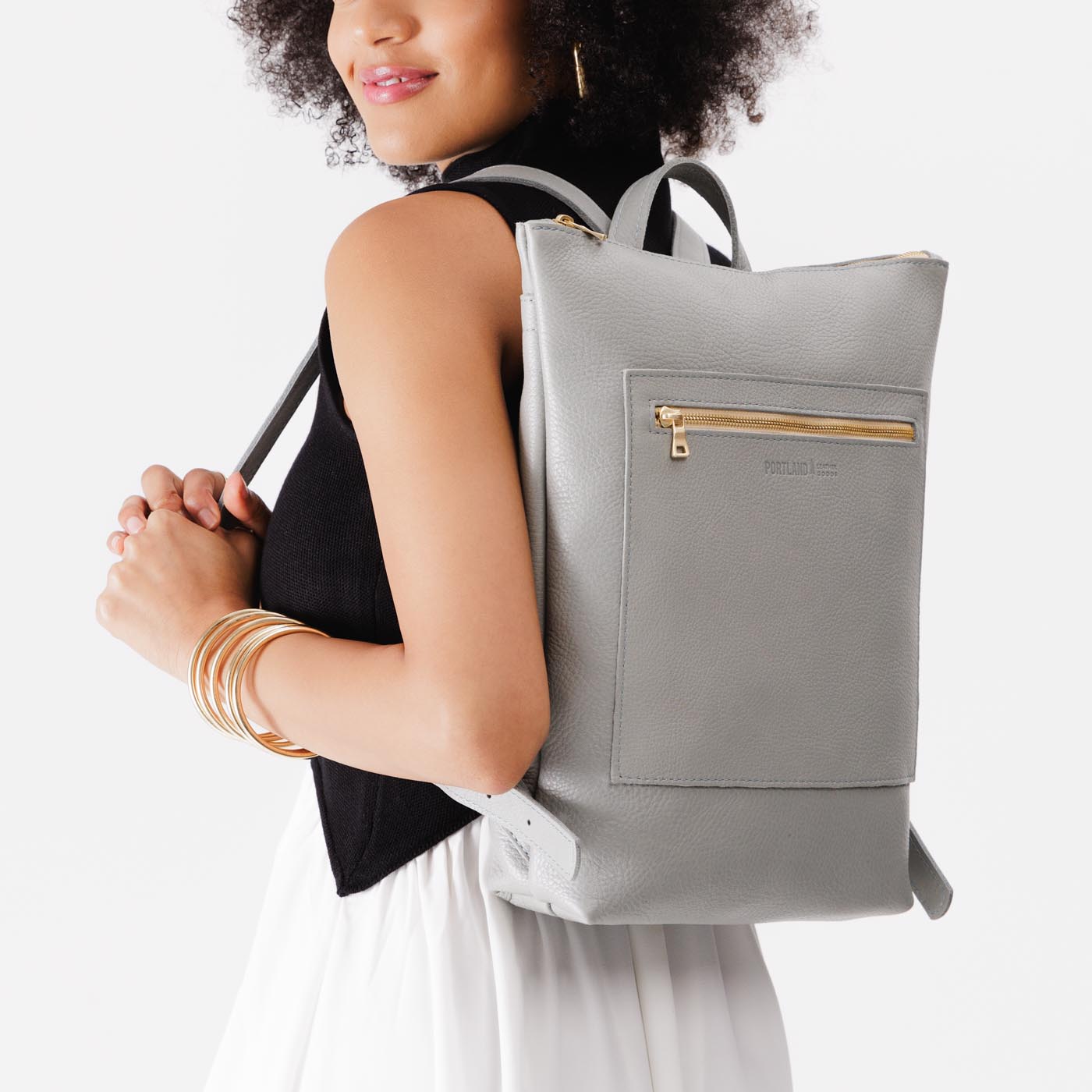 Nimbus | Model wearing rectangular slim leather laptop backpack