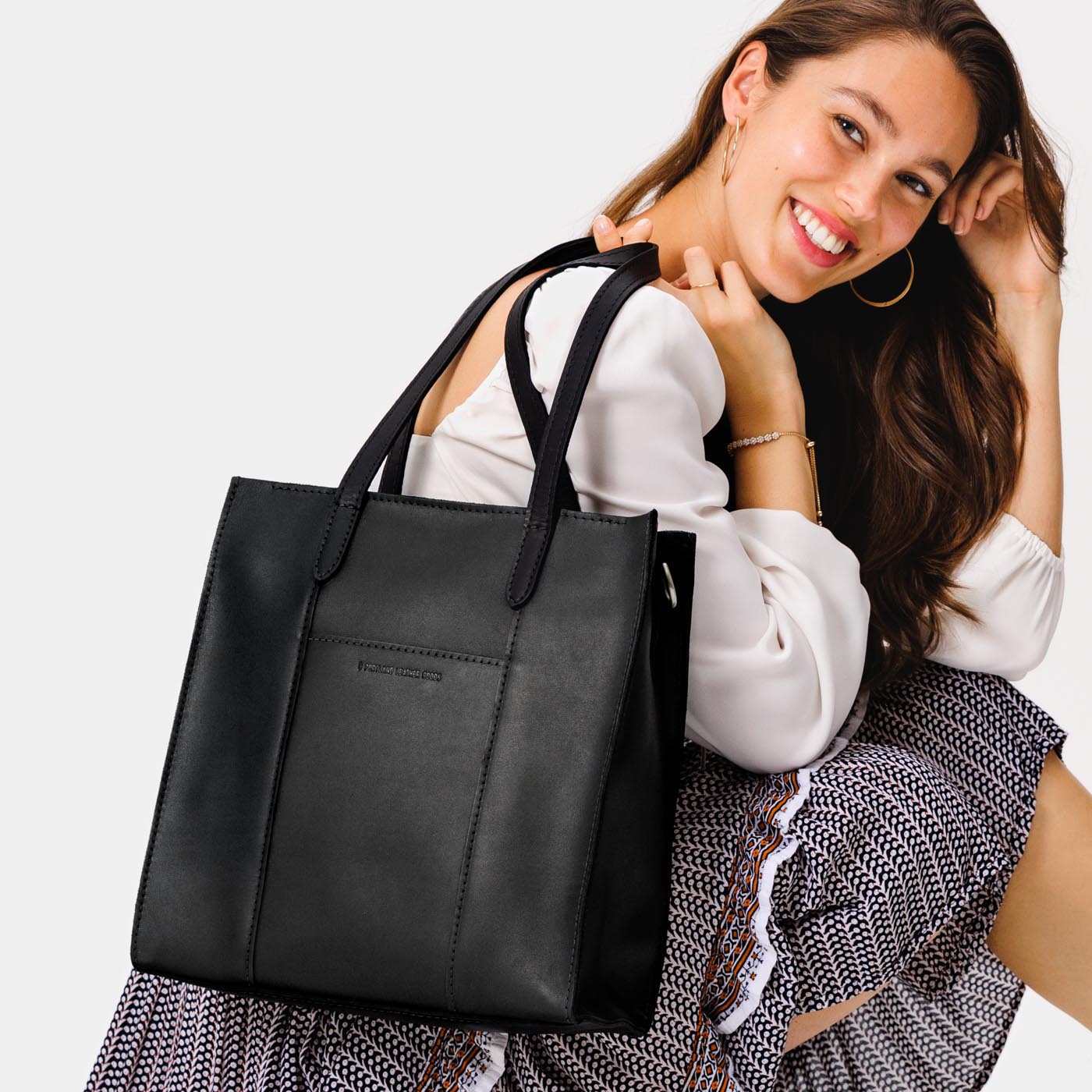  Black*North/South | Structured large tote bag with overlapping panels and crossbody strap