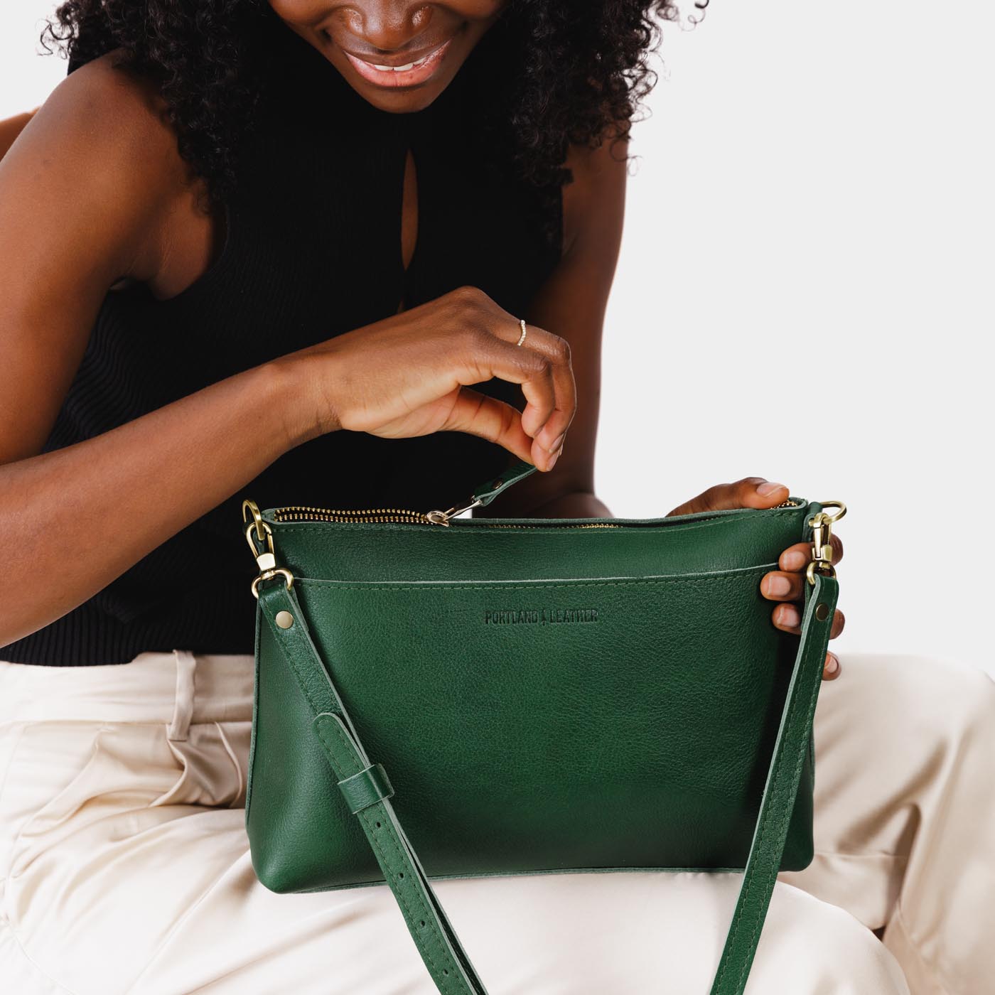 Bacalar | Model holding midsize zip top crossbody bag with detachable strap