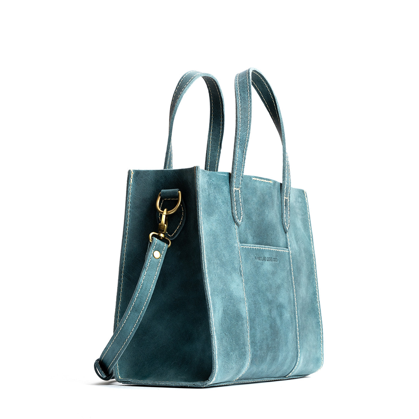 Aqua | Structured mid-size tote bag with overlapping panels and crossbody strap