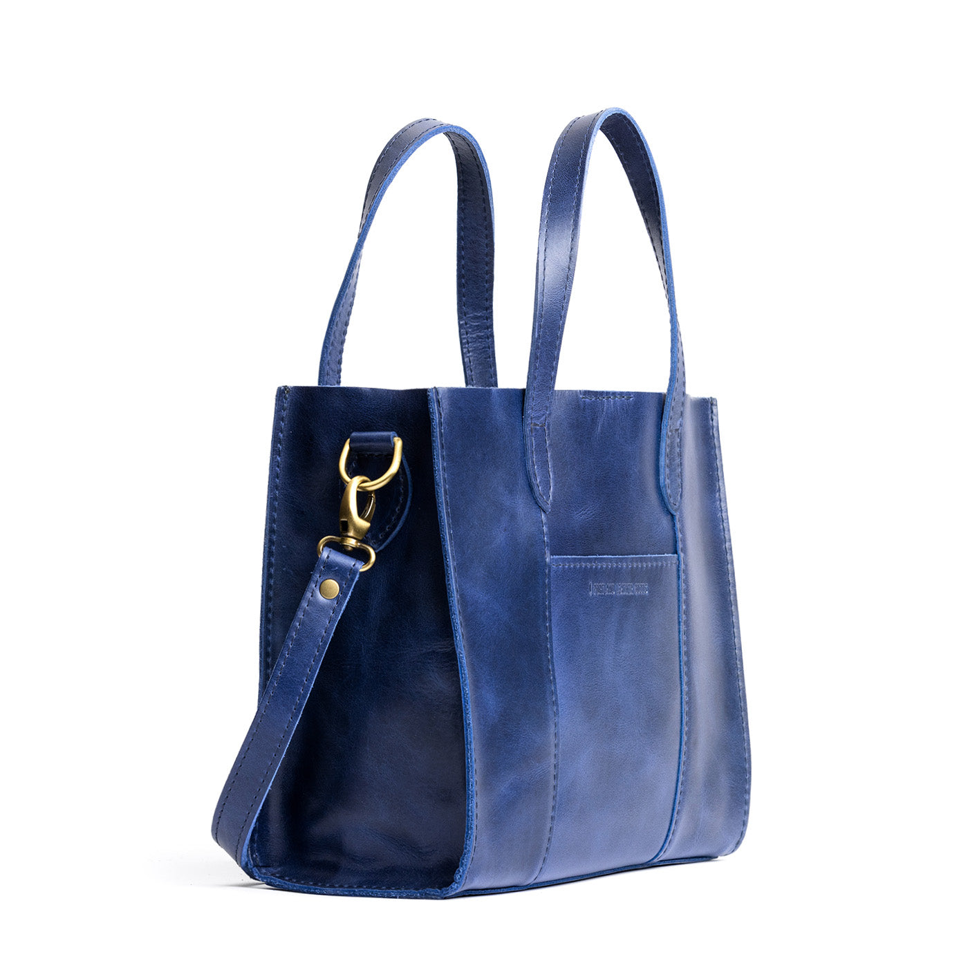 Cowboy Blue | Structured mid-size tote bag with overlapping panels and crossbody strap