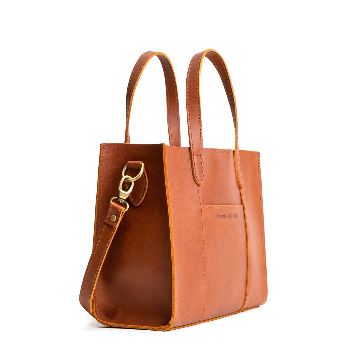 Honey | Structured mid-size tote bag with overlapping panels and crossbody strap