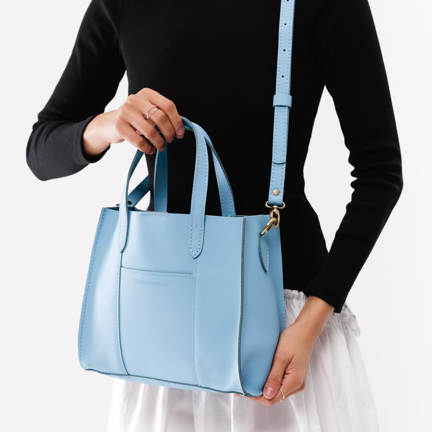 Glacial Blue | Structured mid-size tote bag with overlapping panels and crossbody strap