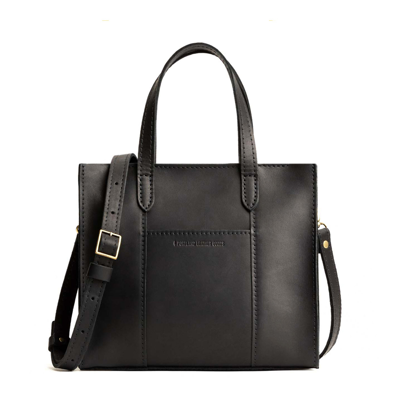 Black Zipper | Structured mid-size tote bag with overlapping panels and crossbody strap