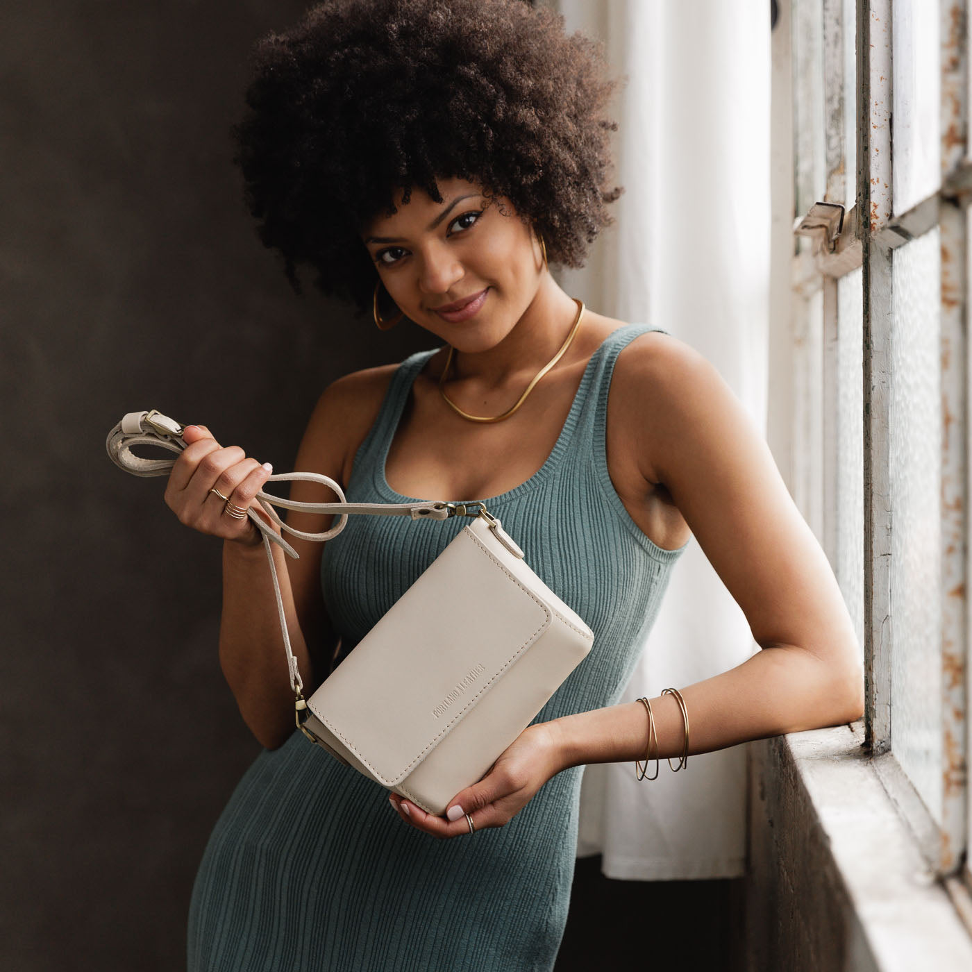 Bone Mini | Model Wearing Small Leather Crossbody Bag with Magnetic Messenger Bag Closure