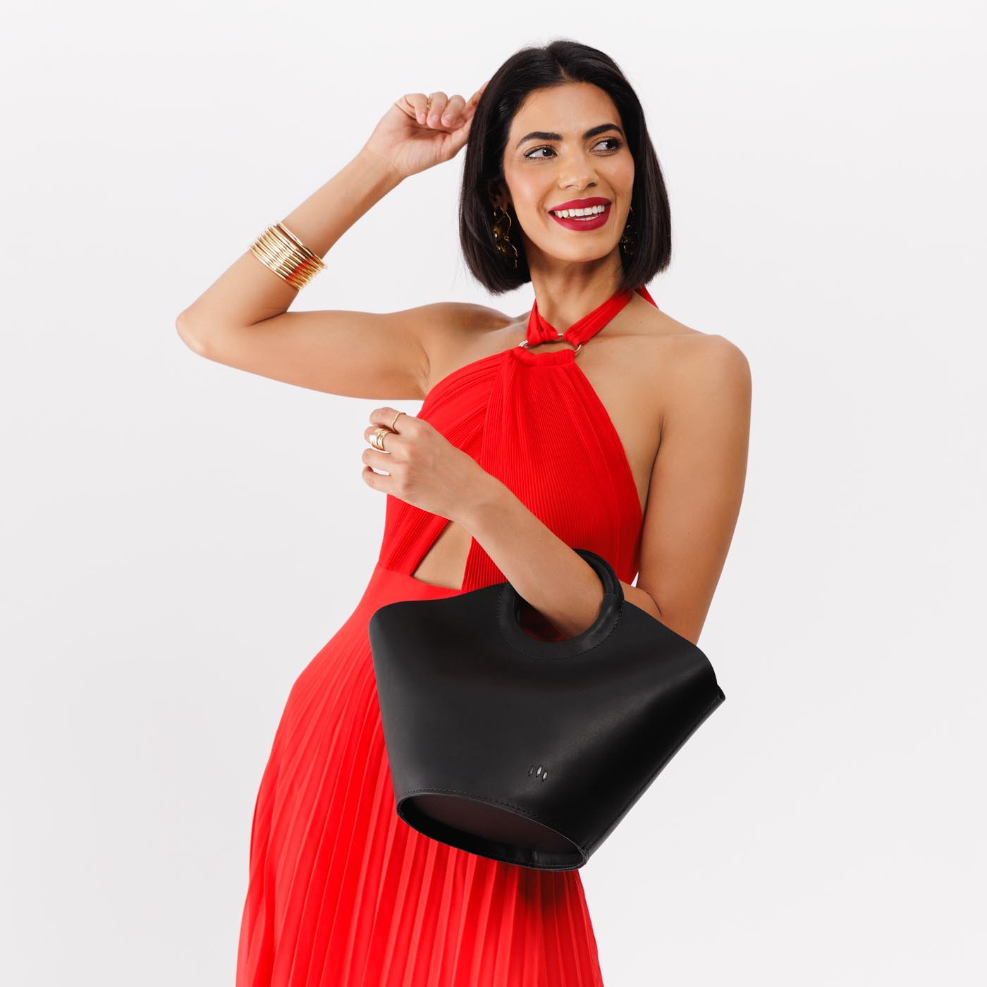 Black*Large | Model holding structured leather hand bag with circular handles