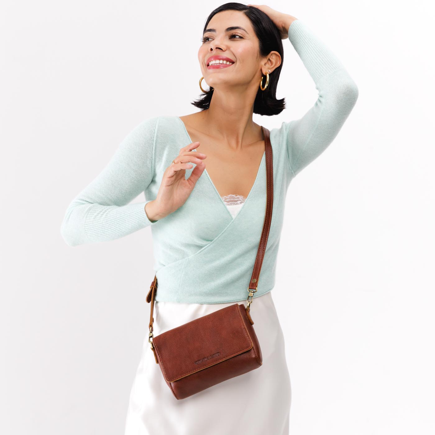 Nutmeg Mini | Model Wearing Small Leather Crossbody Bag with Magnetic Messenger Bag Closure