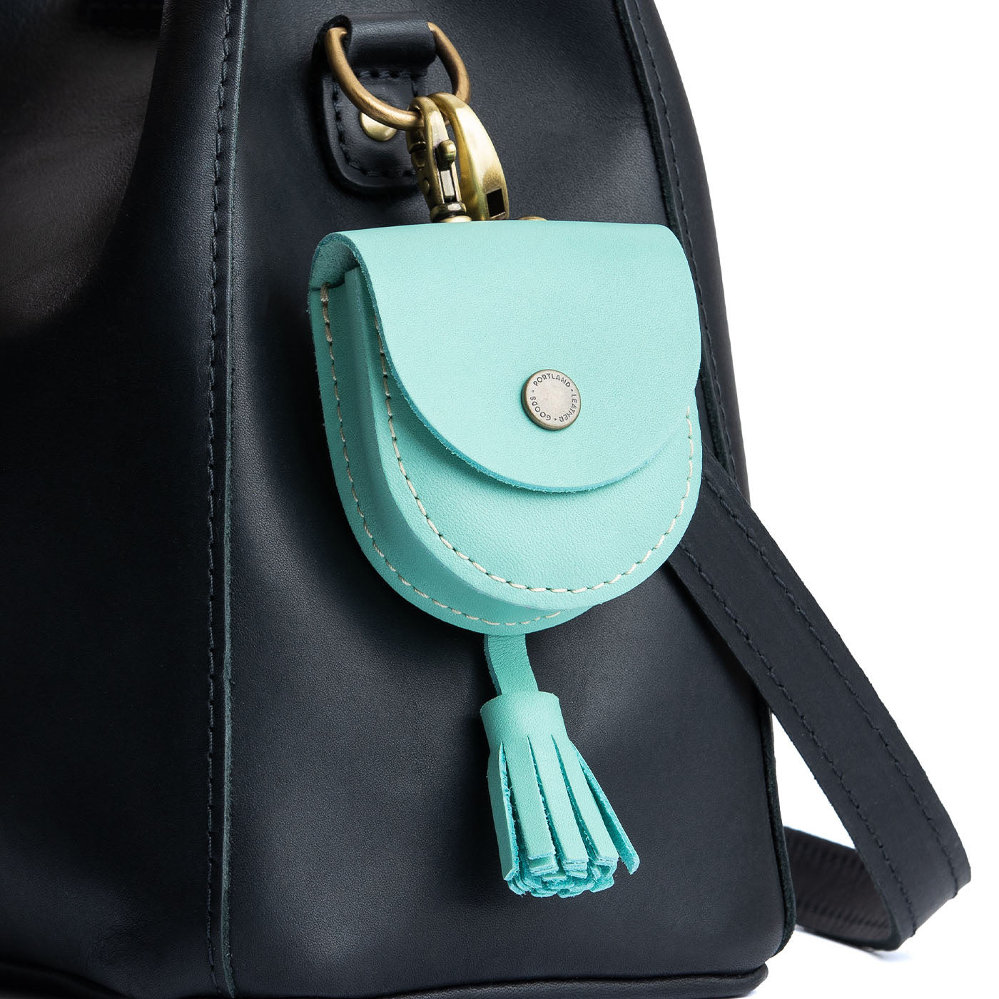 All Color: Mint | U shaped pouch with snap closure, lobster clasp and fringed tassel