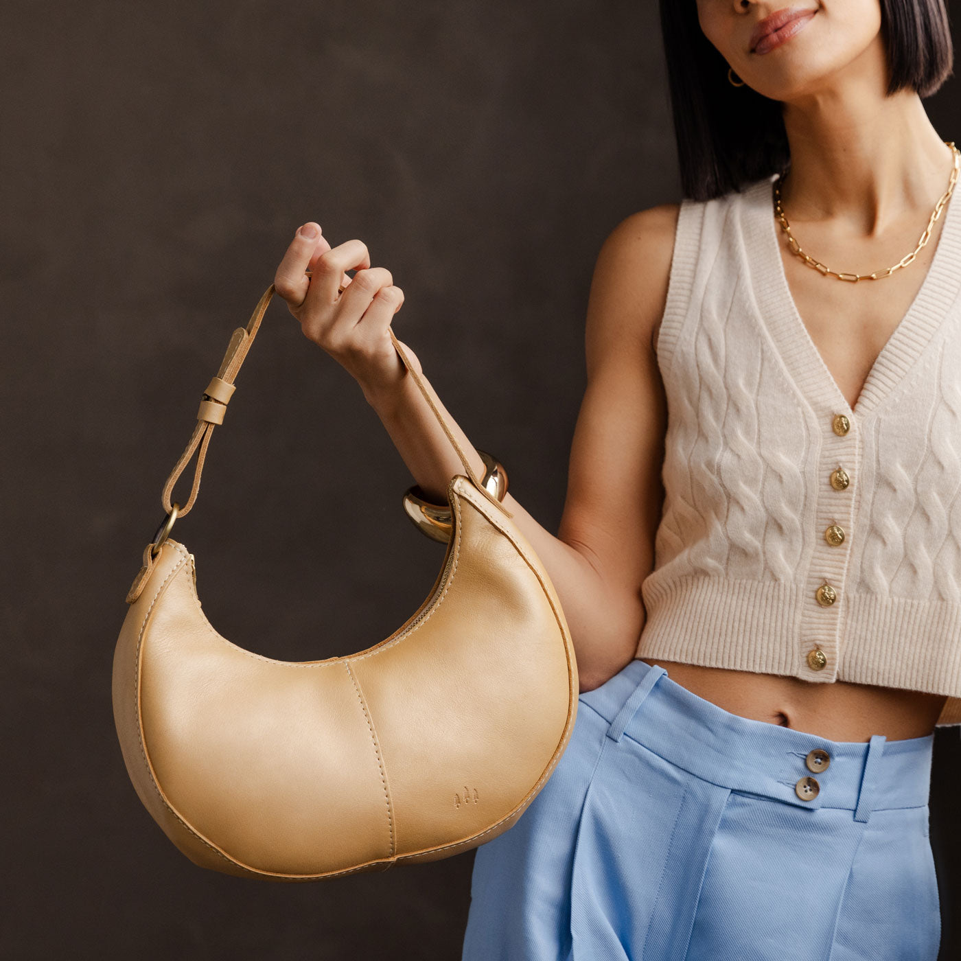 Champagne Classic | Crescent shaped shoulder bag with zipper closure and adjustable strap