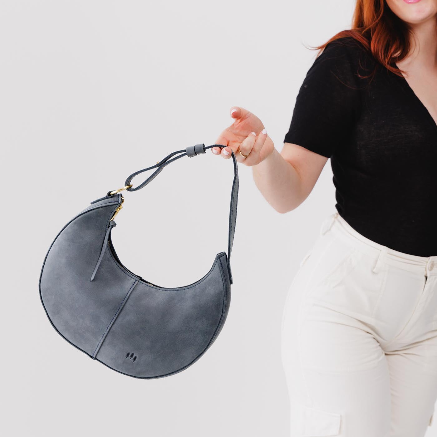 Storm Classic | Crescent shaped shoulder bag with zipper closure and adjustable strap