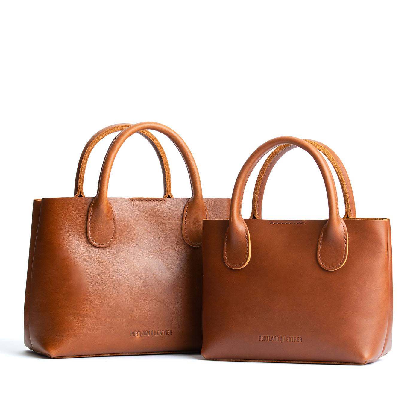 Honey  | Side by side of both tote purses with structured leather handles and crossbody strap