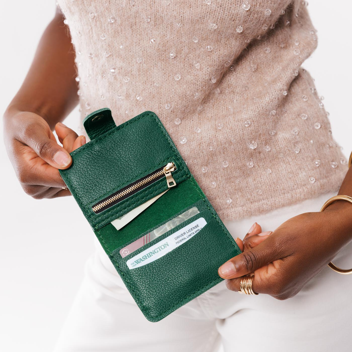 Bacalar | Model holding small leather bifold wallet with snap open