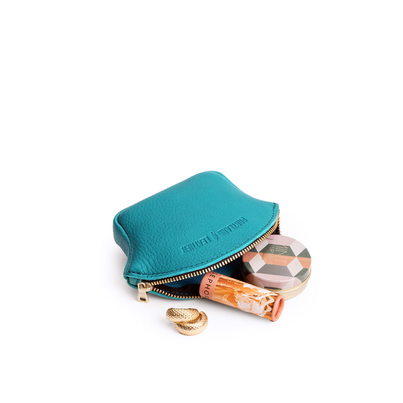 Baja Small | Seashell shaped leather makeup bag with curved top zipper open and flat bottom