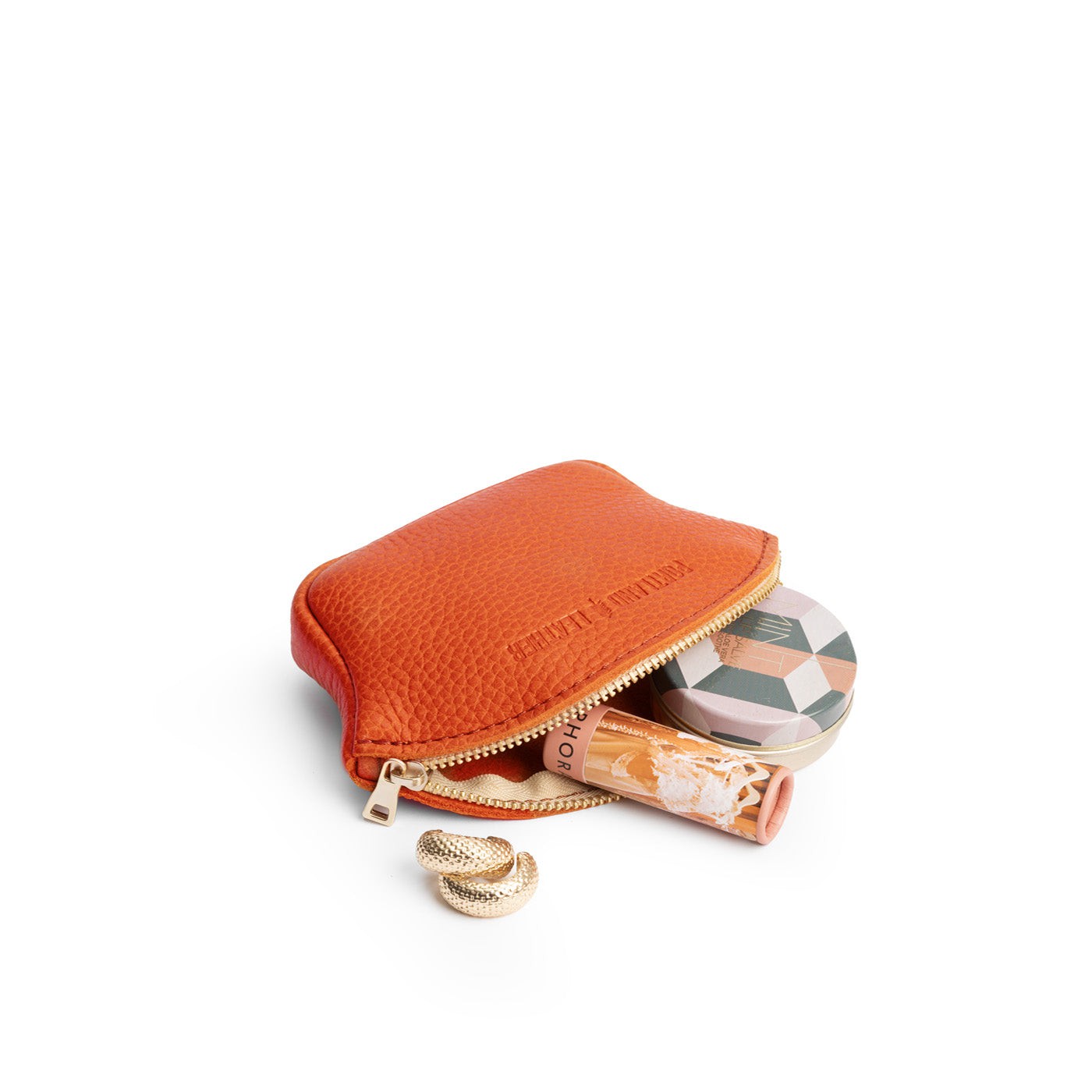 Koi Small | Seashell shaped leather makeup bag with curved top zipper open and flat bottom