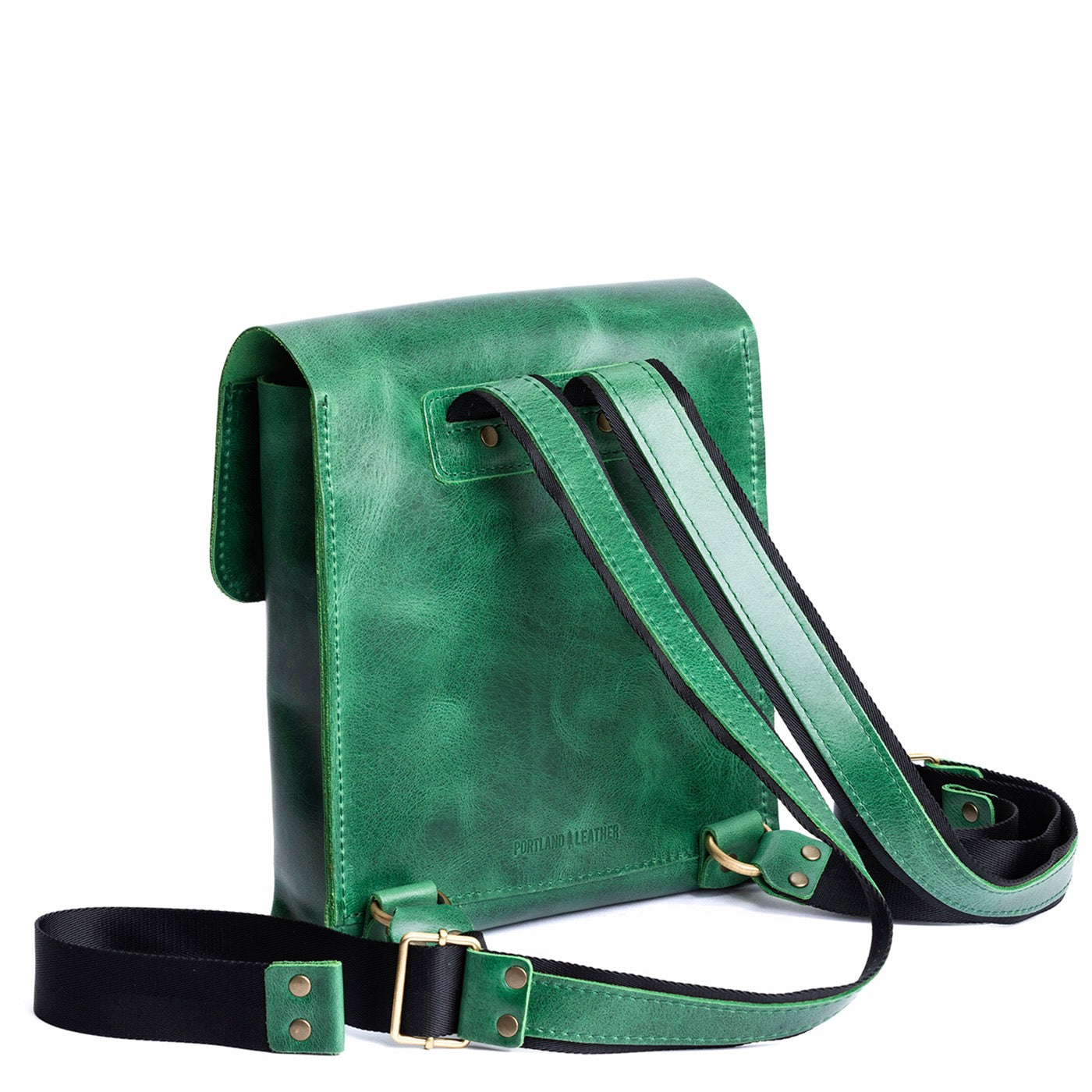 Cowboy Mint | Rectangular backpack with leather lined nylon straps and magnetic flap closure