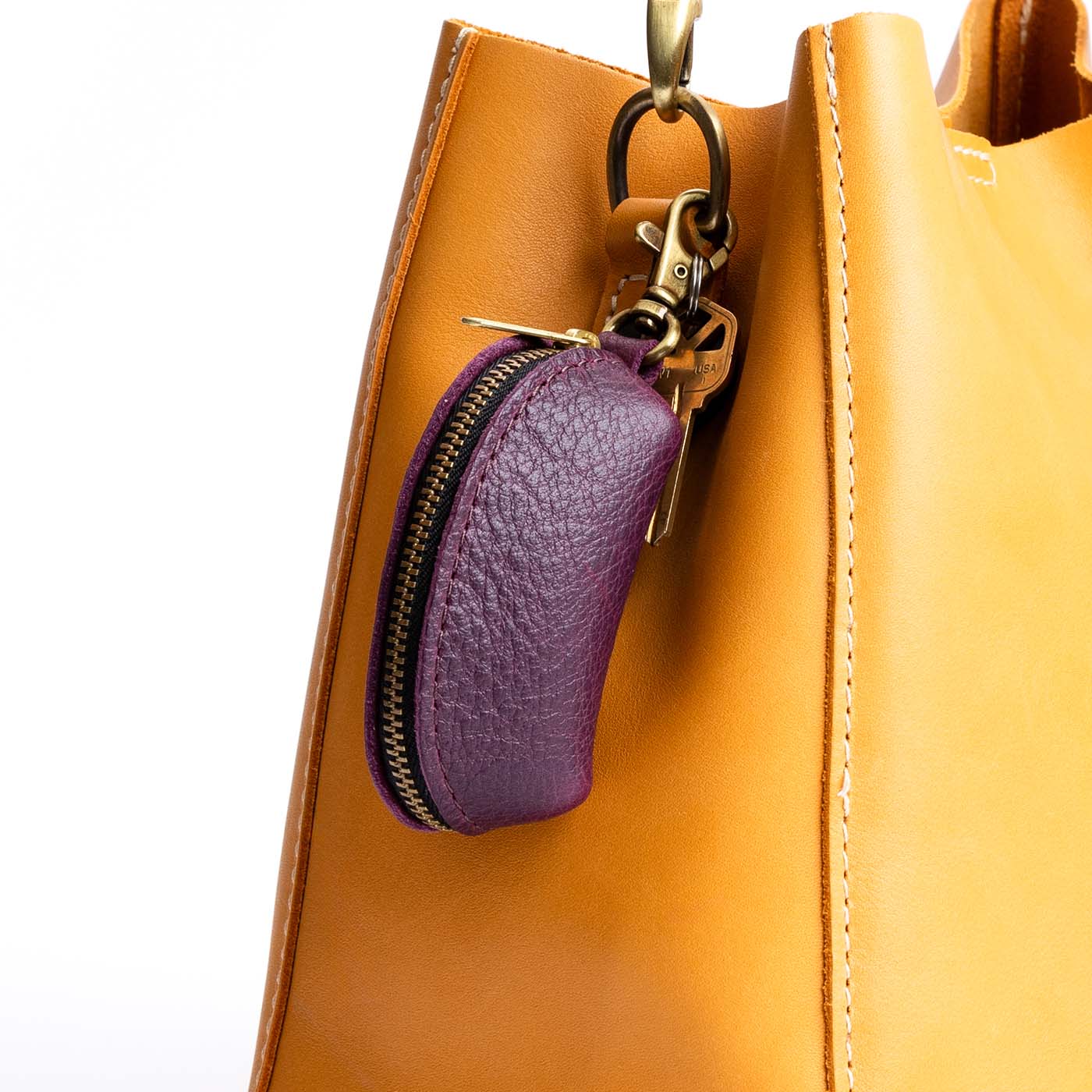 All Color: Plum | Small taco shaped pouch, swivel lobster clasp