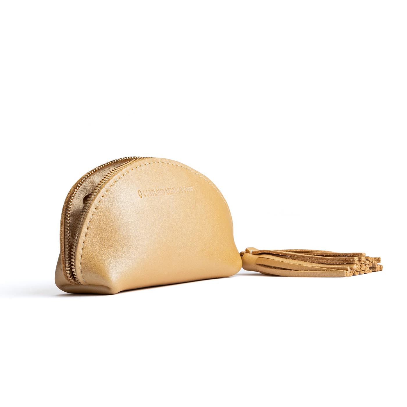 All Color: Champagne | Small leather zippered pouch with tassel