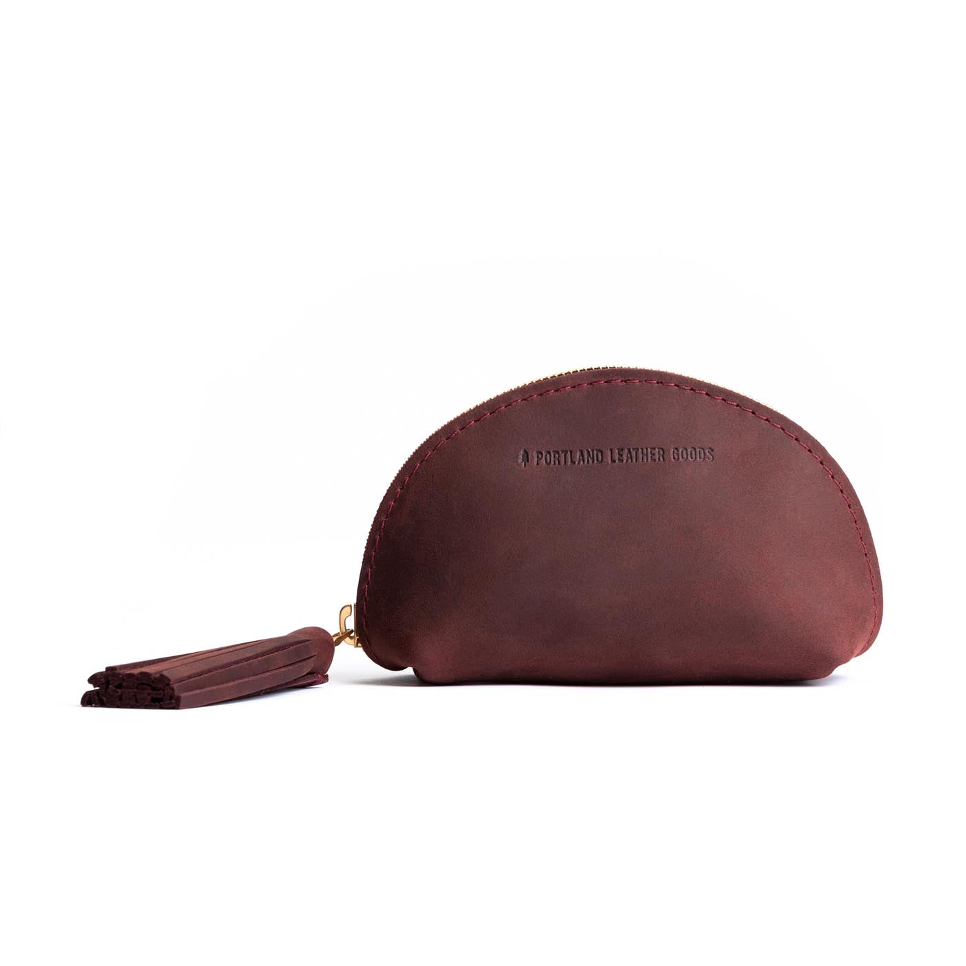 All Color: Merlot | Small leather zippered pouch with tassel