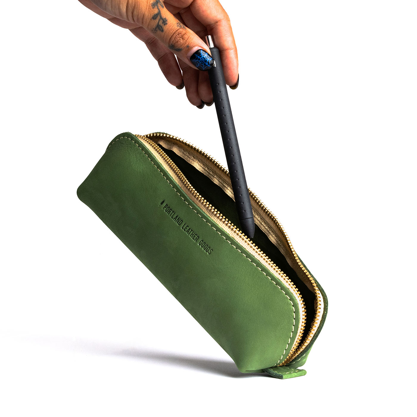 All Color: Succulent | Leather pouch with curved seams and top zipper