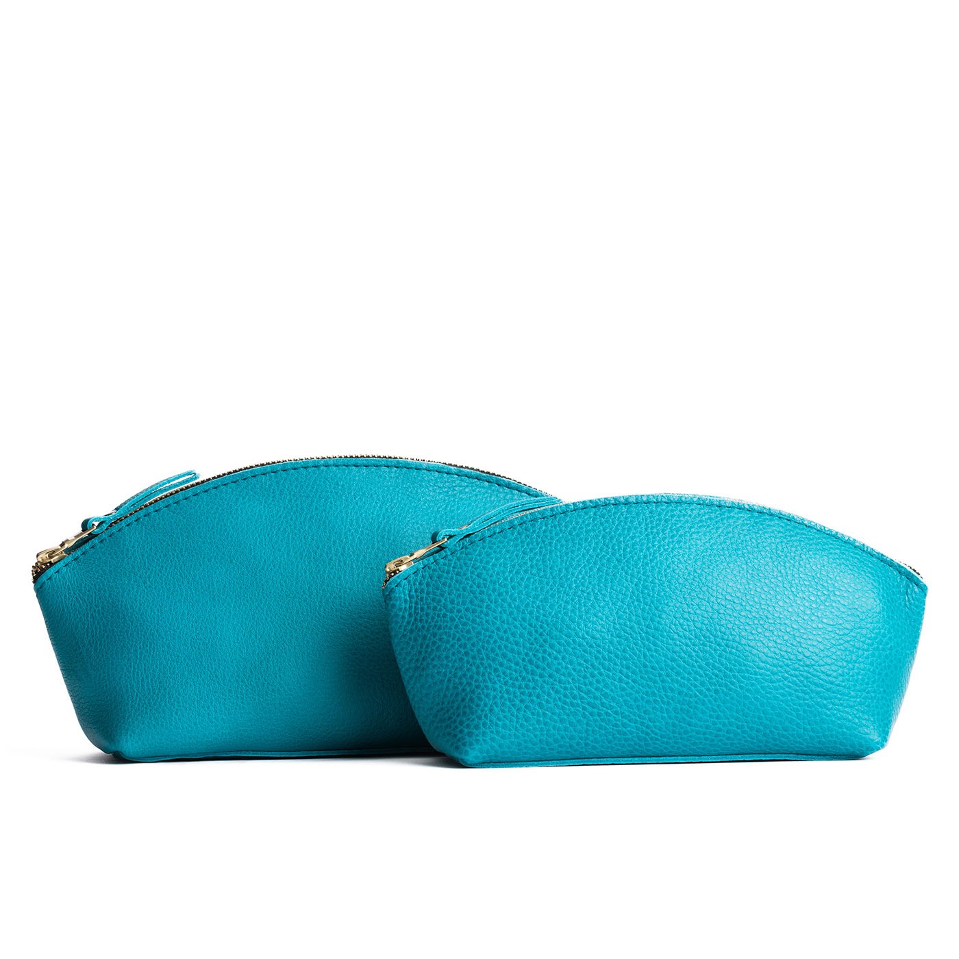 Baja | Spacious leather makeup bag with curved seams and top zipper