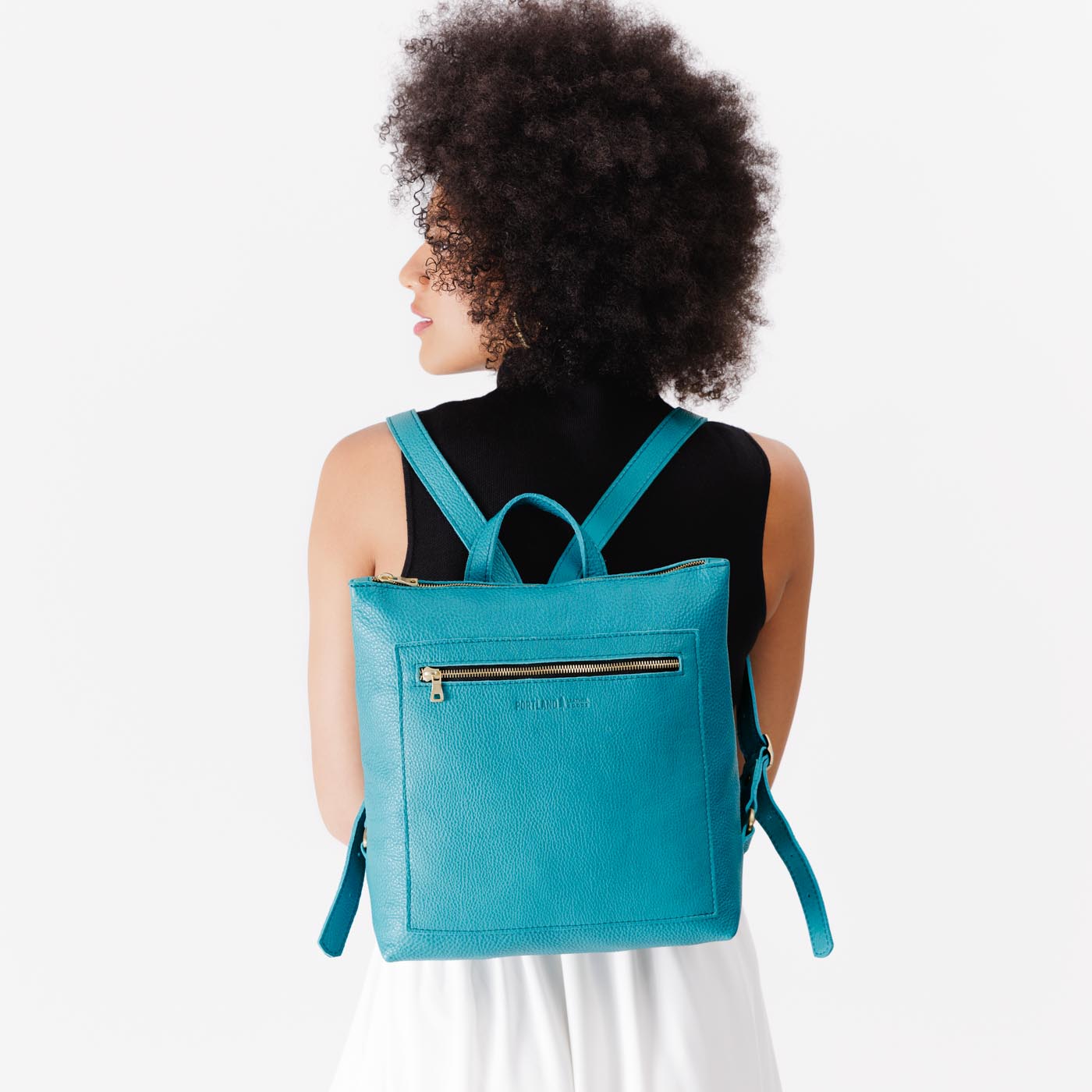 Baja | Model wearing square slim leather tote backpack