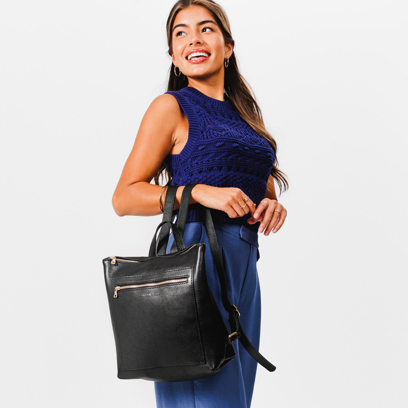 All Color: Pebbled--black | Model holding square slim leather tote backpack