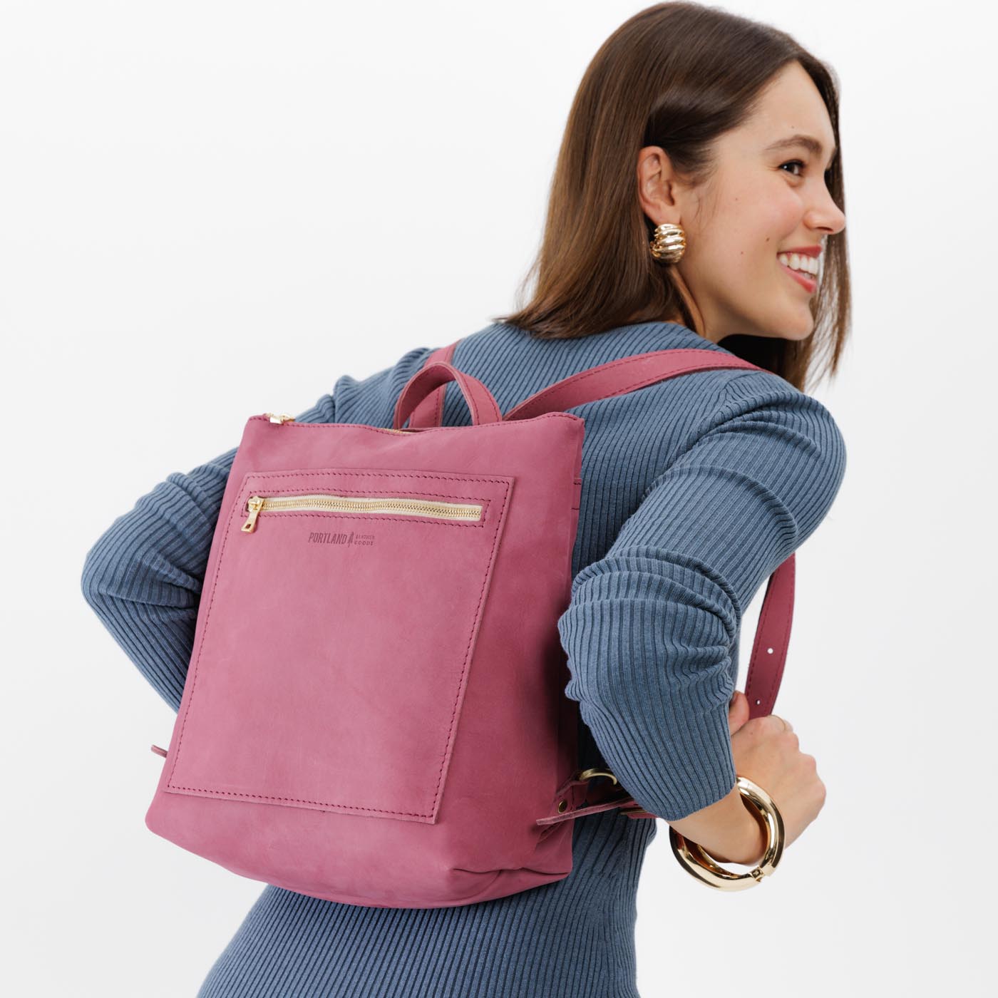 All Color: Foxglove | Model wearing square slim leather tote backpack