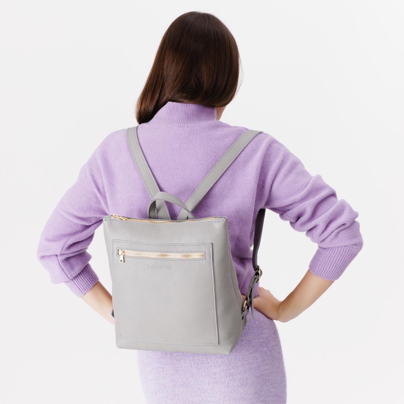 Nimbus | Model wearing square slim leather tote backpack