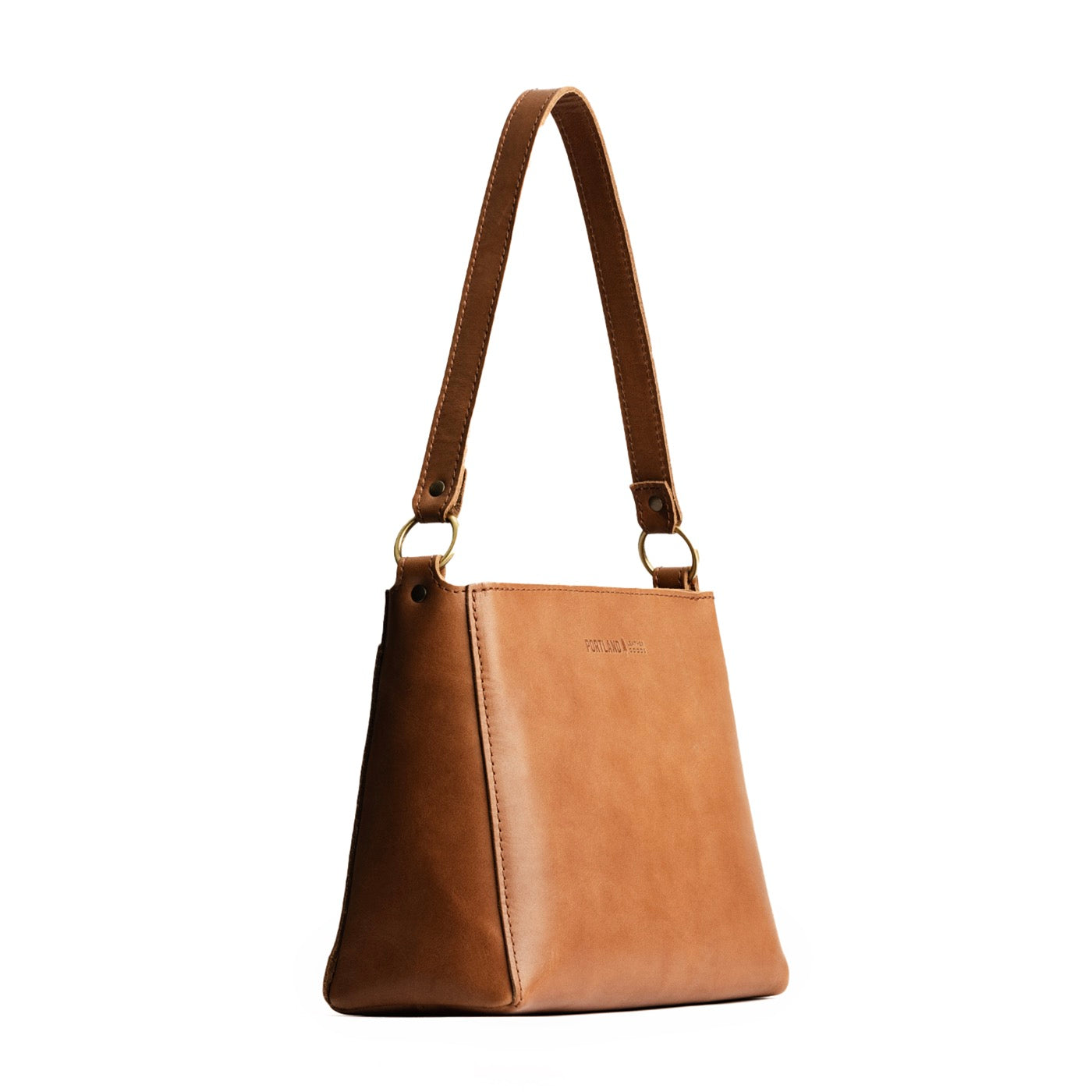 Biscotti | Triangular shoulder bag with antiqued brass finished hardware