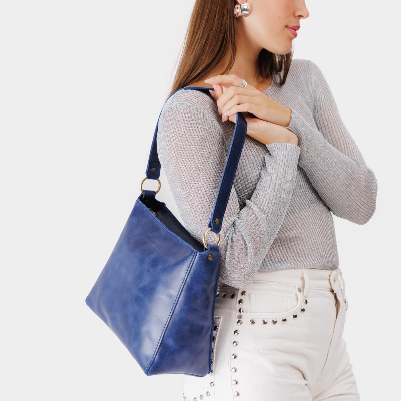 Cowboy Blue | Triangular shoulder bag with antiqued brass finished hardware