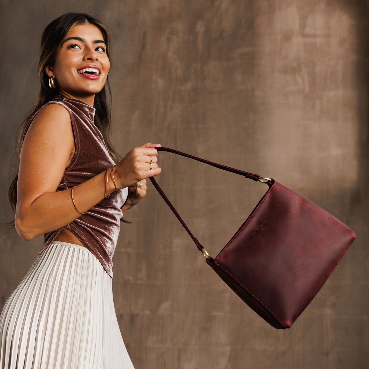  Merlot | Triangular shoulder bag with antiqued brass finished hardware