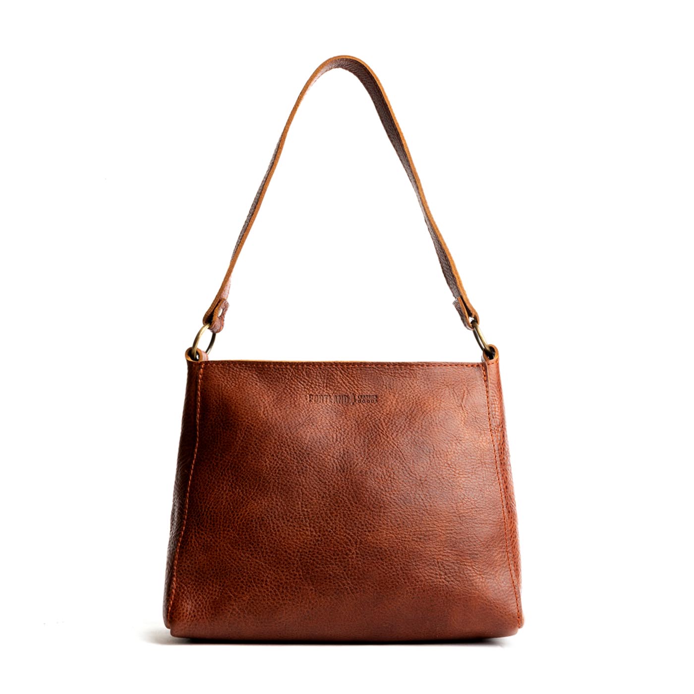 Nutmeg | Triangular shoulder bag with antiqued brass finished hardware