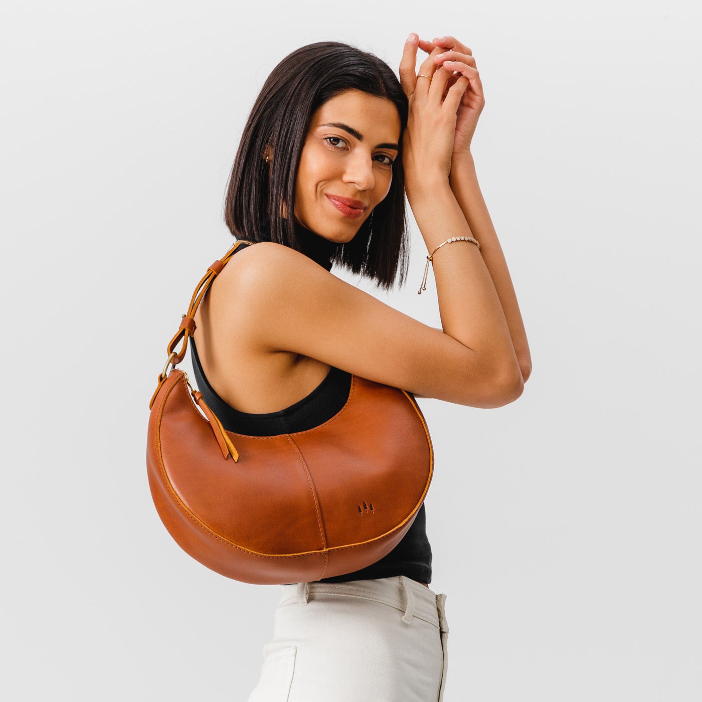 Honey*Classic | Crescent shaped shoulder bag with zipper closure and adjustable strap