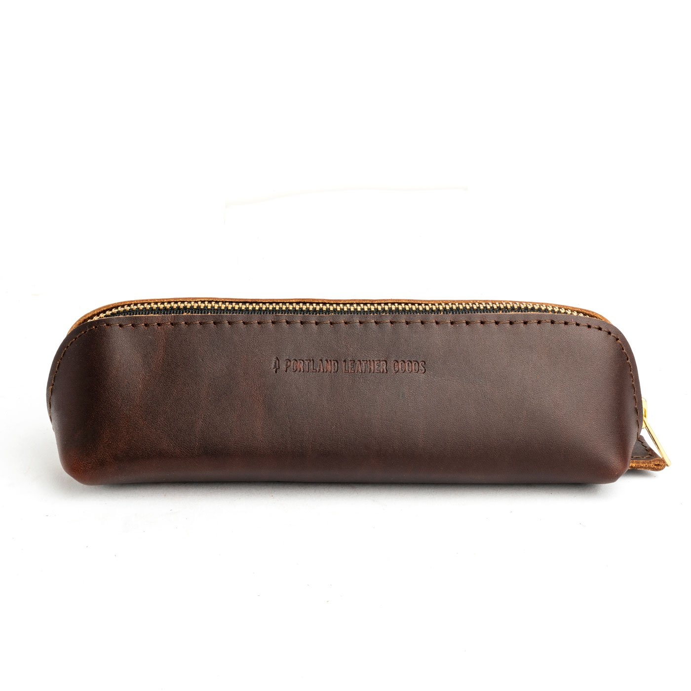 All Color: Grizzly | Leather pouch with curved seams and top zipper